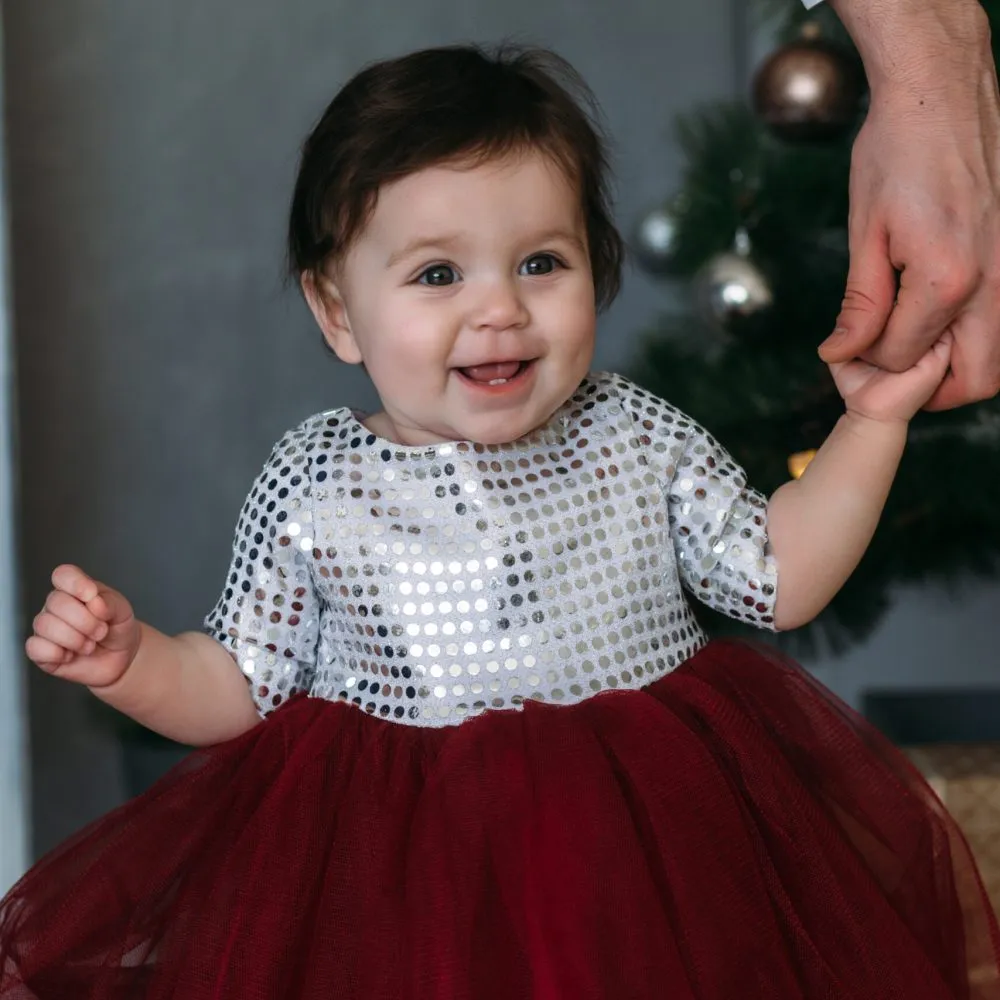 The charming child stands in the room
